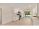 Clean, modern kitchen featuring white cabinetry, stainless steel appliances, and a sliding glass door at 908 S Kachina --, Mesa, AZ 85204