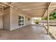This covered patio features a concrete floor and access to the backyard at 908 S Kachina --, Mesa, AZ 85204