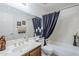 Well-lit bathroom featuring a large mirror, vanity with marble top, and a bathtub with shower, offering functionality at 9705 E Mountain View Rd # 1096, Scottsdale, AZ 85258