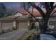 Charming townhome with a red tile roof and a two-car garage, complemented by mature landscaping at 9705 E Mountain View Rd # 1096, Scottsdale, AZ 85258