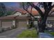 Charming two-story home featuring a brown tile roof, stucco walls, and two-car garage at 9705 E Mountain View Rd # 1096, Scottsdale, AZ 85258