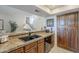 Kitchen counter featuring granite countertops and dark cabinets, perfect for food prep, offering a functional space at 9705 E Mountain View Rd # 1096, Scottsdale, AZ 85258