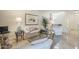 Inviting living room featuring neutral tones, a plush sofa, and an accent rug, creating a cozy and sophisticated space at 9705 E Mountain View Rd # 1096, Scottsdale, AZ 85258
