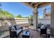 Inviting covered patio area with comfortable seating and decorative accents, perfect for outdoor relaxation at 9705 E Mountain View Rd # 1096, Scottsdale, AZ 85258