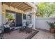 Spacious outdoor patio with seating area and sliding glass door entrance at 9705 E Mountain View Rd # 1096, Scottsdale, AZ 85258