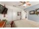 Comfortable bedroom with closet and view to ensuite bathroom at 991 N Quail Ln, Gilbert, AZ 85233