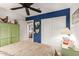 Bright bedroom featuring a modern ceiling fan and unique heart mirrors at 991 N Quail Ln, Gilbert, AZ 85233