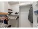 Walk-in closet with clothing racks and built-in shelves for organization at 991 N Quail Ln, Gilbert, AZ 85233