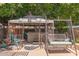 Outdoor hot tub covered by a gazebo with a wrought iron swing and seating area at 991 N Quail Ln, Gilbert, AZ 85233