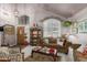 Inviting living room featuring vaulted ceilings, a chandelier, and an abundance of natural light at 991 N Quail Ln, Gilbert, AZ 85233