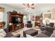 Spacious living room with modern furniture, a large TV, and an abundance of natural light at 991 N Quail Ln, Gilbert, AZ 85233