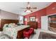 Comfortable main bedroom with plush carpet, decorative rug, and a large dresser at 991 N Quail Ln, Gilbert, AZ 85233