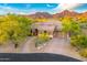 Aerial view of a luxurious home with mountain views at 10694 E Redfield Rd, Scottsdale, AZ 85255