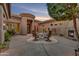Private courtyard with a fireplace and outdoor seating area at 10694 E Redfield Rd, Scottsdale, AZ 85255