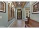 Inviting foyer with unique artwork and designer touches that add a touch of elegance to the home at 10694 E Redfield Rd, Scottsdale, AZ 85255