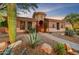 Charming home with desert landscaping and a walkway at 10694 E Redfield Rd, Scottsdale, AZ 85255