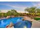 Breathtaking pool and spa area with rock features and views of the surrounding desert landscape at 10694 E Redfield Rd, Scottsdale, AZ 85255