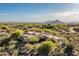 Expansive desert property showcasing the home's unique architecture and natural desert landscape at 10822 E Prospect Point Dr, Scottsdale, AZ 85262