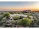 Desert home boasts stunning mountain views from this aerial perspective showcasing its sprawling landscape and desert surroundings at 10822 E Prospect Point Dr, Scottsdale, AZ 85262
