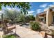 Relaxing backyard with a spa, lush landscaping, and comfortable seating perfect for outdoor enjoyment at 10822 E Prospect Point Dr, Scottsdale, AZ 85262