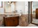 Bathroom features granite counters, wood cabinets, and a walk-in shower at 10822 E Prospect Point Dr, Scottsdale, AZ 85262