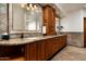 Bathroom features dual sinks, granite countertop, and warm wood cabinetry at 10822 E Prospect Point Dr, Scottsdale, AZ 85262