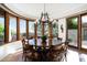Sun-filled dining room features a large round table and scenic views at 10822 E Prospect Point Dr, Scottsdale, AZ 85262
