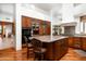 Well-appointed kitchen features custom cabinets, granite countertops and stainless steel appliances at 10822 E Prospect Point Dr, Scottsdale, AZ 85262