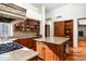 Open-concept kitchen boasts granite countertops, custom cabinetry, and an oversized island at 10822 E Prospect Point Dr, Scottsdale, AZ 85262