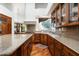 Charming kitchen with custom cabinets, granite countertops, and eat-in breakfast area at 10822 E Prospect Point Dr, Scottsdale, AZ 85262