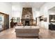 Expansive living room showcases a stone fireplace, high ceilings, and open floor plan at 10822 E Prospect Point Dr, Scottsdale, AZ 85262