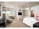 Spacious main bedroom with large windows, sitting area, and ceiling fan at 10822 E Prospect Point Dr, Scottsdale, AZ 85262