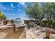 Outdoor kitchen area featuring a built-in grill, stone accents, and desert landscaping at 10822 E Prospect Point Dr, Scottsdale, AZ 85262