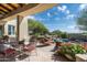 Beautiful outdoor living space with stone accents, a pool, and comfortable seating areas at 10822 E Prospect Point Dr, Scottsdale, AZ 85262