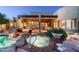 Inviting backyard pool and spa area of desert home, featuring unique rock details and covered patio at 10822 E Prospect Point Dr, Scottsdale, AZ 85262