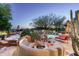 Beautiful pool features a desert landscape, waterfall, and mature trees at 10822 E Prospect Point Dr, Scottsdale, AZ 85262
