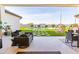 Inviting backyard patio featuring cozy lounge furniture and a refreshing pool view, perfect for outdoor relaxation at 10918 W Dove Roost Rd, Queen Creek, AZ 85144