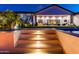 Backyard with a pool and inviting patio area with hanging chairs, perfect for relaxing and entertaining outdoors at 10918 W Dove Roost Rd, Queen Creek, AZ 85144
