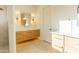 Elegant bathroom with double vanity, modern lighting, and sleek design at 10918 W Dove Roost Rd, Queen Creek, AZ 85144