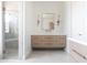 Bright bathroom features a walk-in shower, modern vanity, and decorative lighting at 10918 W Dove Roost Rd, Queen Creek, AZ 85144