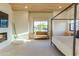Bright bedroom boasts a modern fireplace, sitting area with lots of natural light, and a cozy atmosphere at 10918 W Dove Roost Rd, Queen Creek, AZ 85144