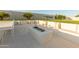 Outdoor firepit with built-in seating, ideal for entertaining friends and Gathering in a cozy atmosphere at 10918 W Dove Roost Rd, Queen Creek, AZ 85144