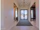 Elegant foyer with modern lighting and views of the front yard, creating a welcoming and stylish entrance at 10918 W Dove Roost Rd, Queen Creek, AZ 85144