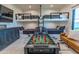 Spacious game room boasts bunk beds, foosball table, and a cozy couch for ultimate entertainment at 10918 W Dove Roost Rd, Queen Creek, AZ 85144