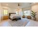 Bright and spacious main bedroom features ample natural light and a decorative rug at 10918 W Dove Roost Rd, Queen Creek, AZ 85144