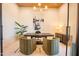 Stylish home office features a modern desk, chairs, art, and a bright, professional workspace at 10918 W Dove Roost Rd, Queen Creek, AZ 85144
