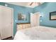 Comfortable bedroom featuring cool-toned walls, hardwood floors, and quaint furniture at 11596 W Sierra Dawn Blvd # 271, Surprise, AZ 85378
