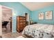 Inviting bedroom with cool blue walls and an interesting antique chest-of-drawers at 11596 W Sierra Dawn Blvd # 271, Surprise, AZ 85378