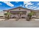 Charming manufactured home featuring a welcoming front yard with mature landscaping and a cozy covered parking area at 11596 W Sierra Dawn Blvd # 271, Surprise, AZ 85378