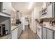 Spacious kitchen with grey cabinets, granite countertops, stainless sink, and modern white appliances at 11596 W Sierra Dawn Blvd # 271, Surprise, AZ 85378